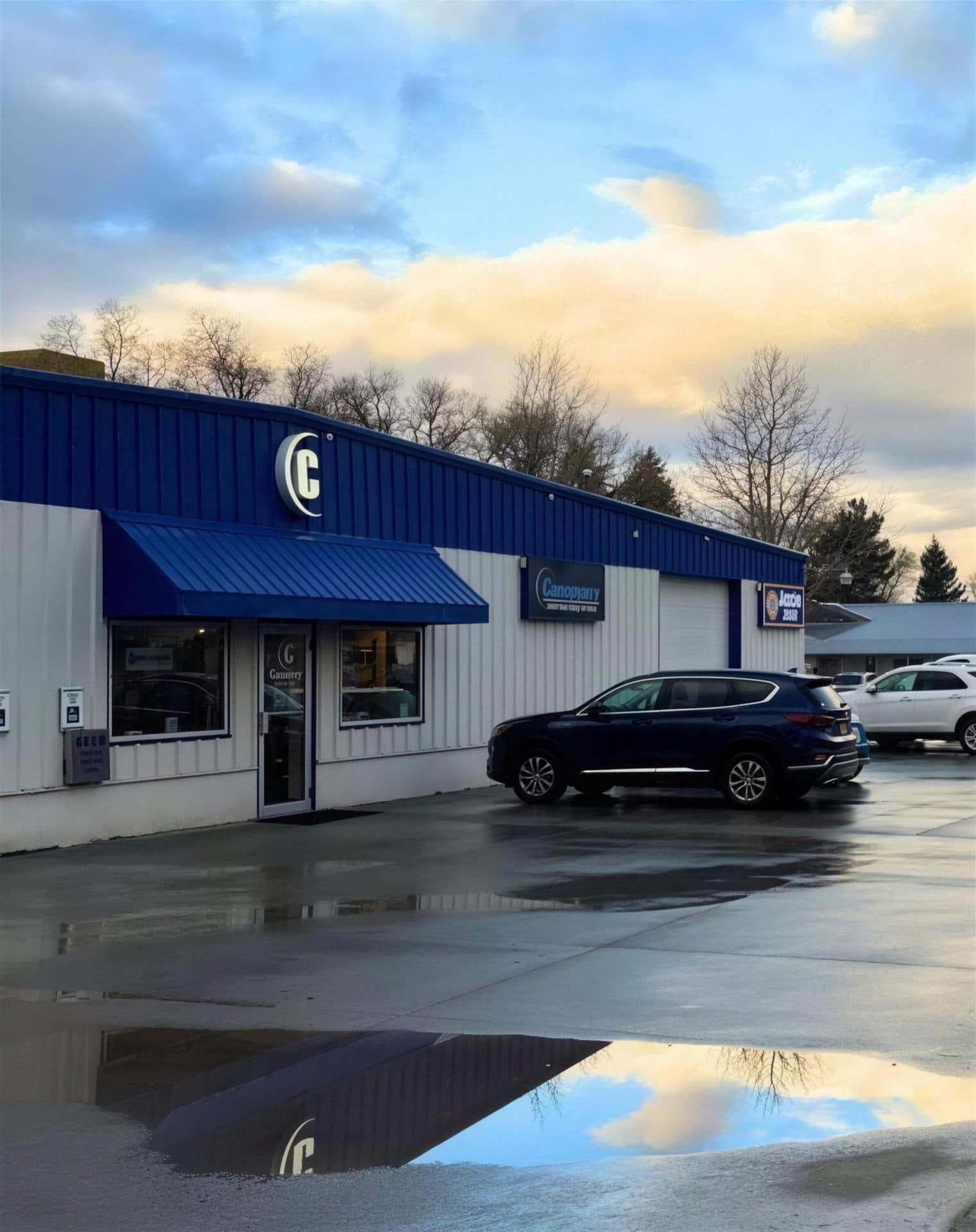 Chapman's Automotive shop on Victory Way in Craig, Colorado, with the cyan C sign and vehicles out front